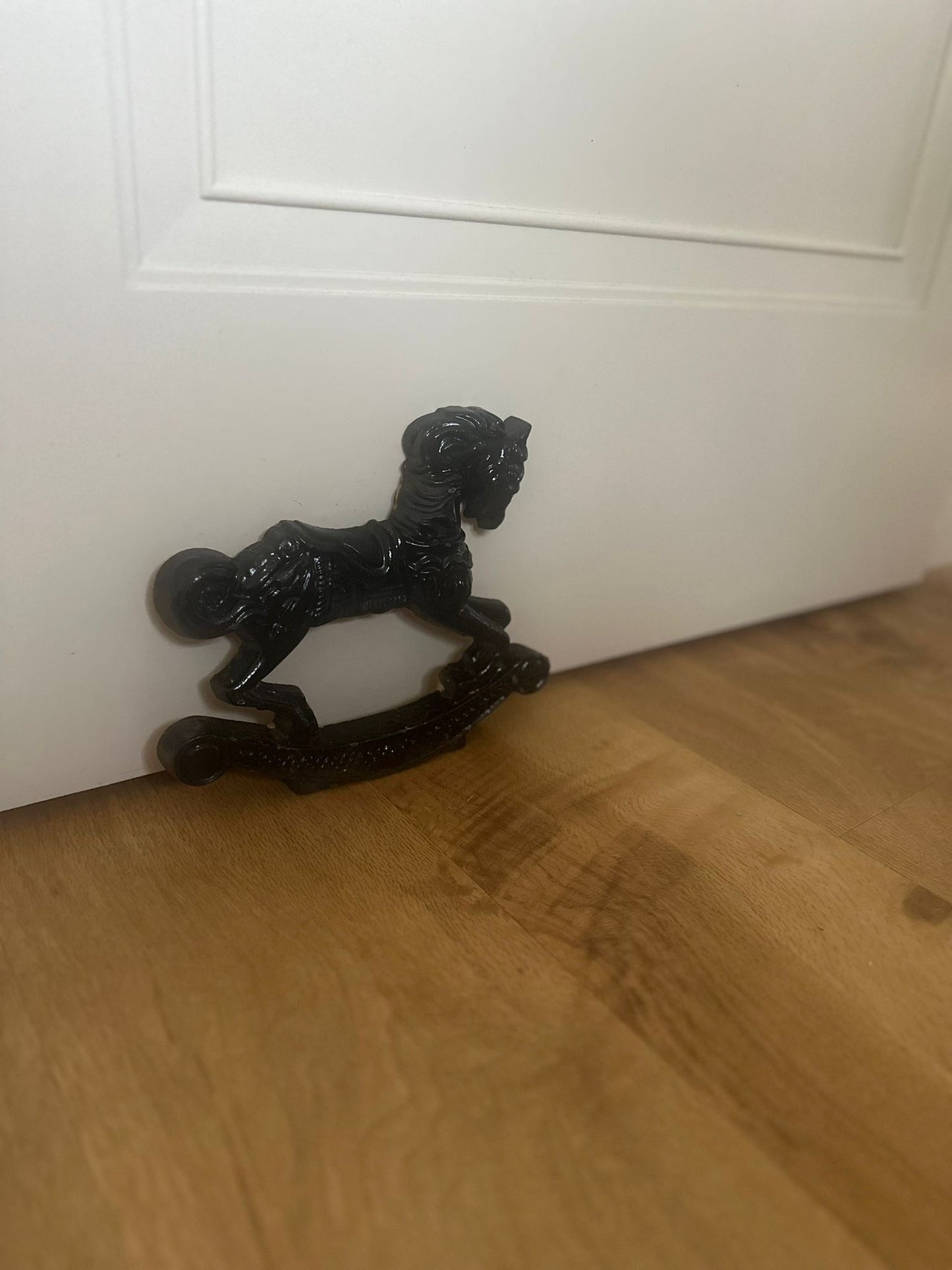 Vintage cast iron rocking horse doorstop