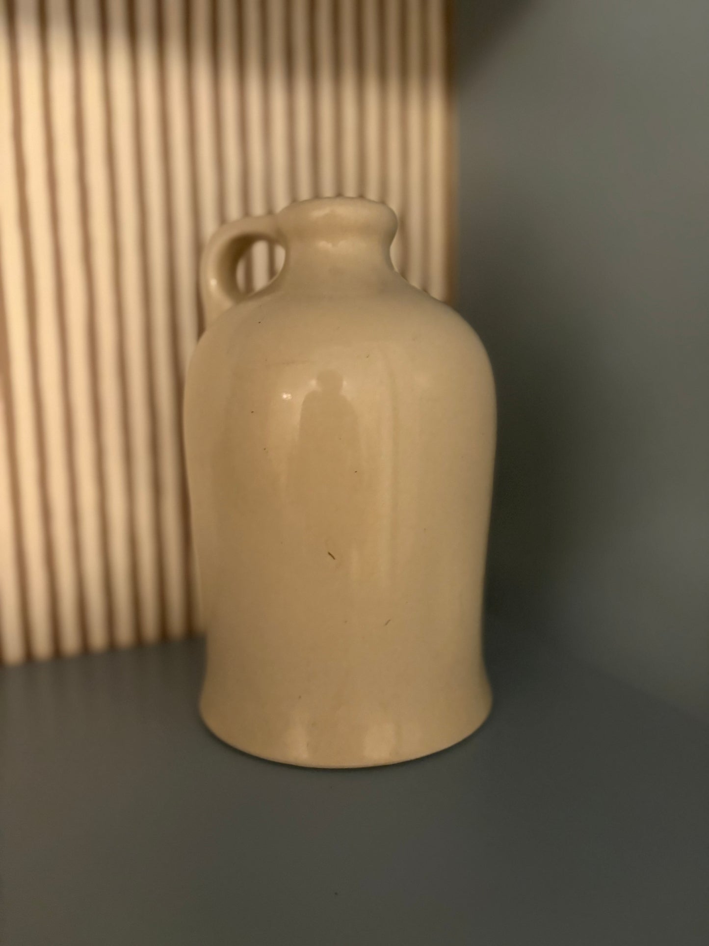 Cream & blue whisky advertising urn