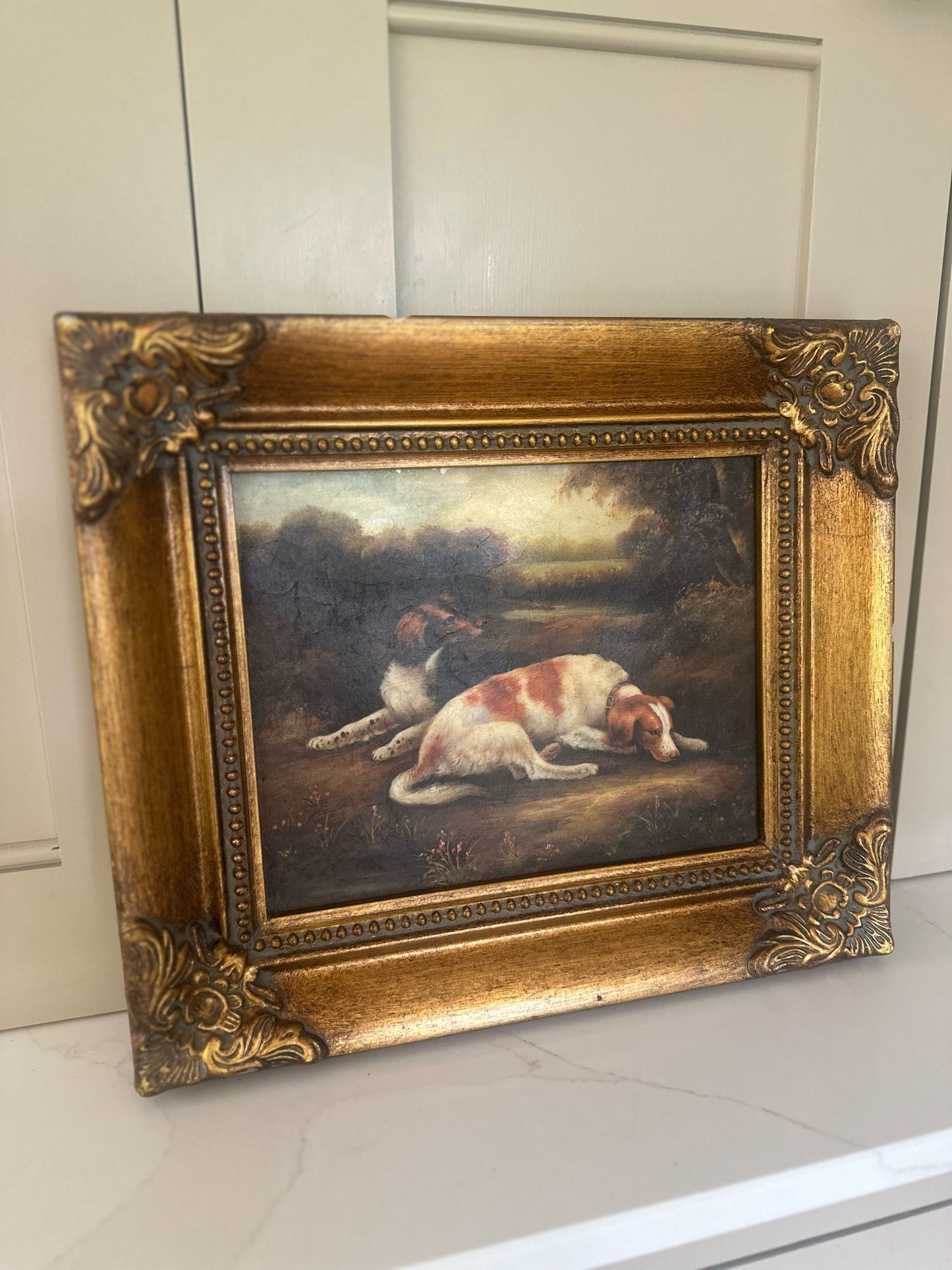 framed oleograph of dogs