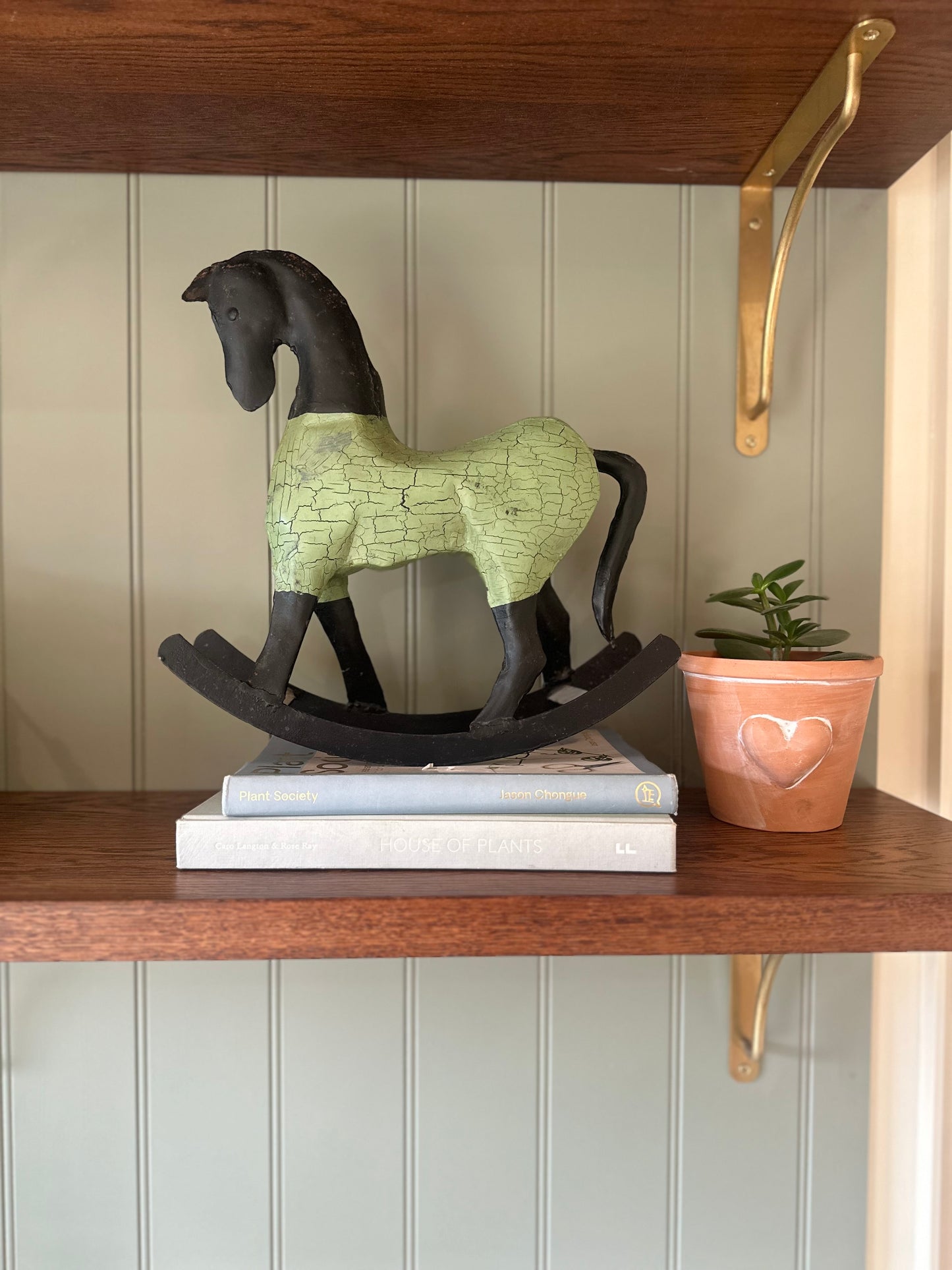 Vintage iron rocking horse styling piece