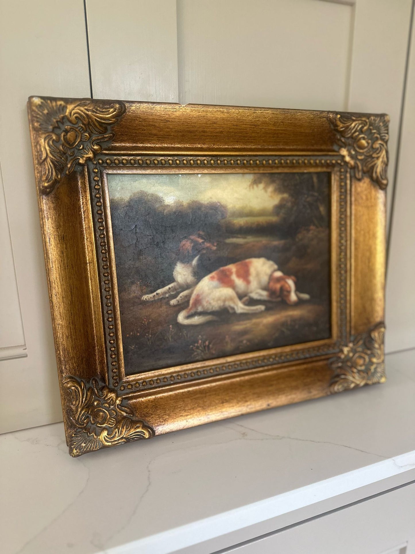 framed oleograph of dogs