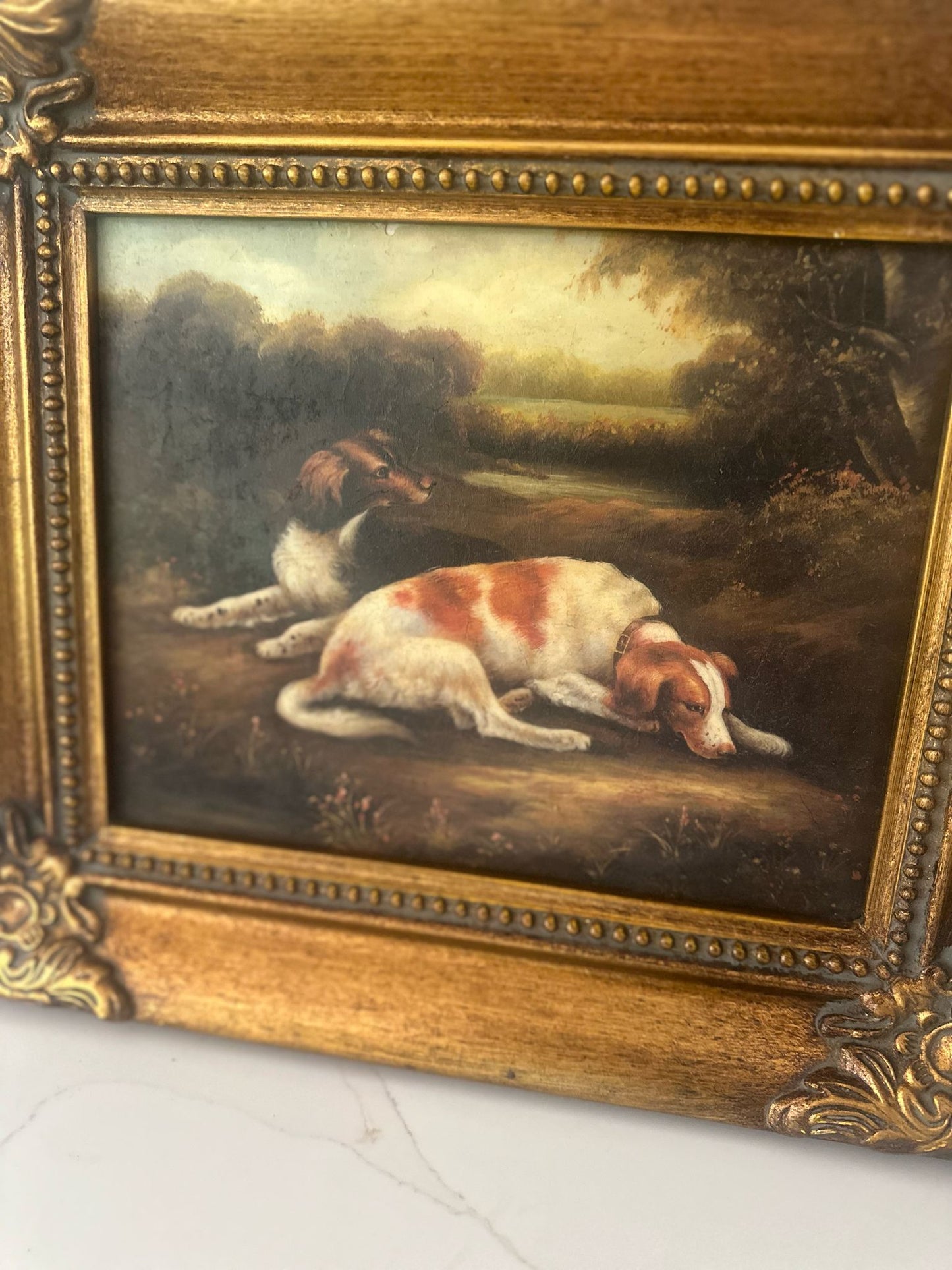 framed oleograph of dogs