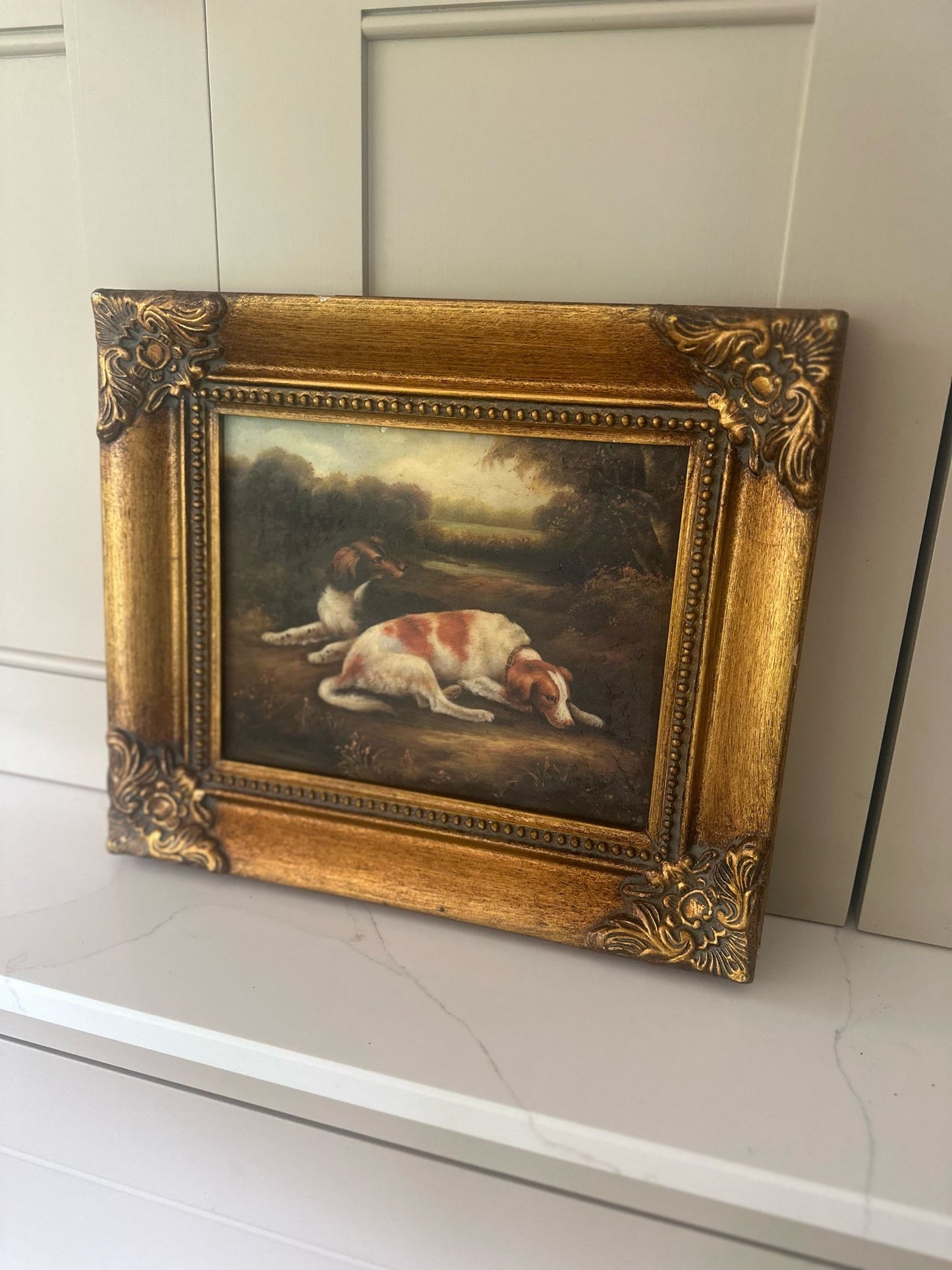 framed oleograph of dogs