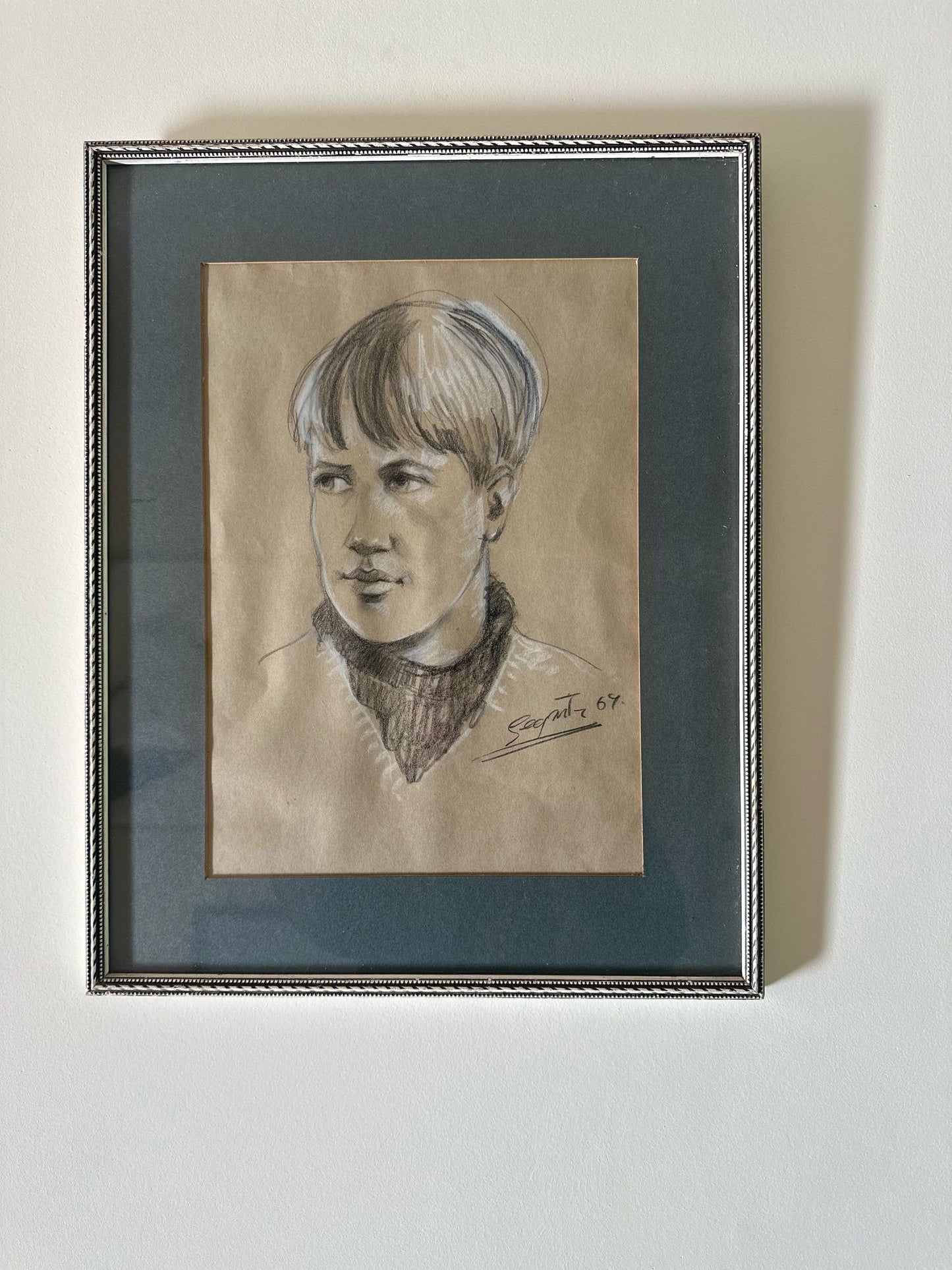pencil of boy signed & framed neutral colours