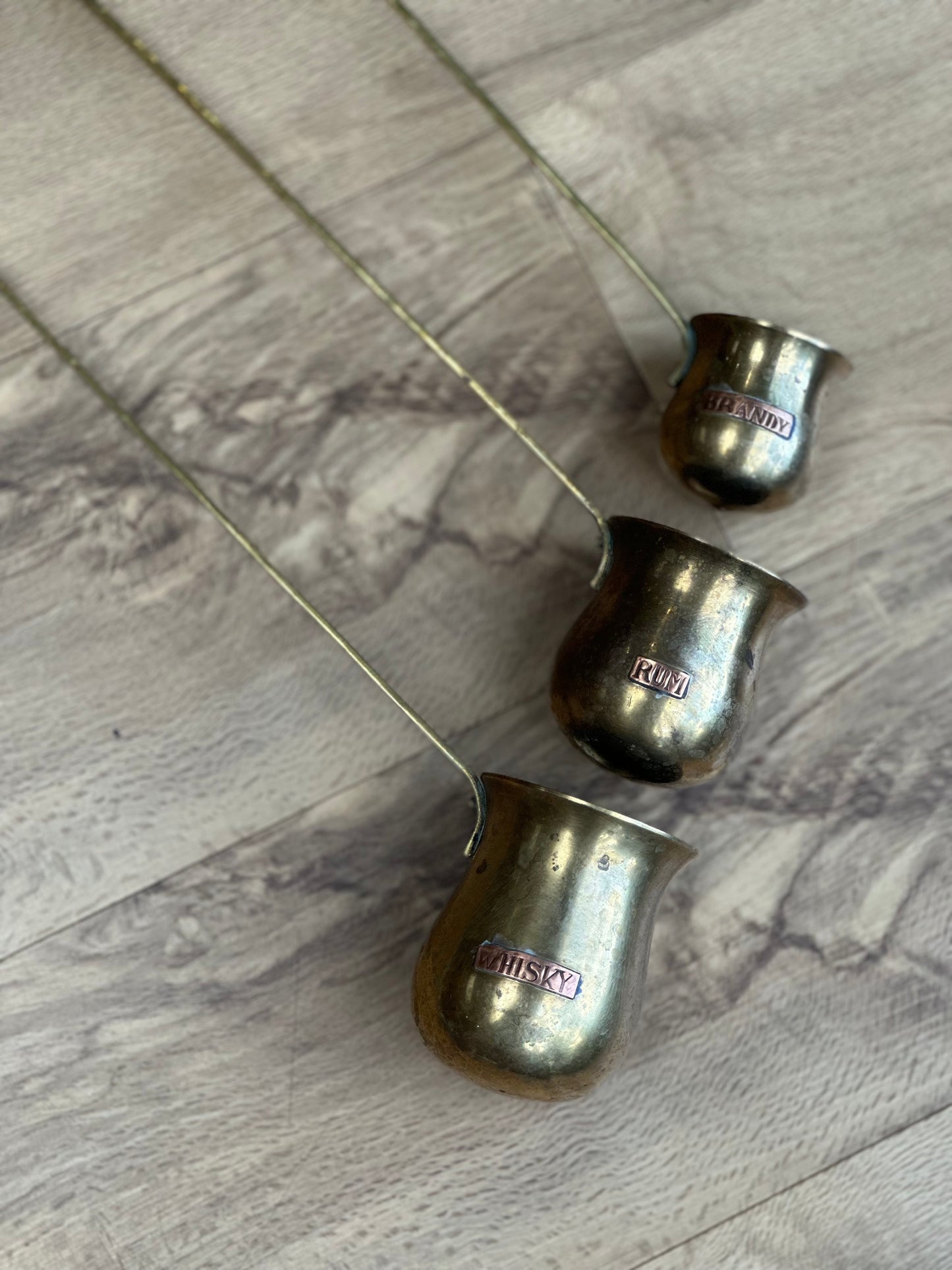 Vintage brass hanging measure cups