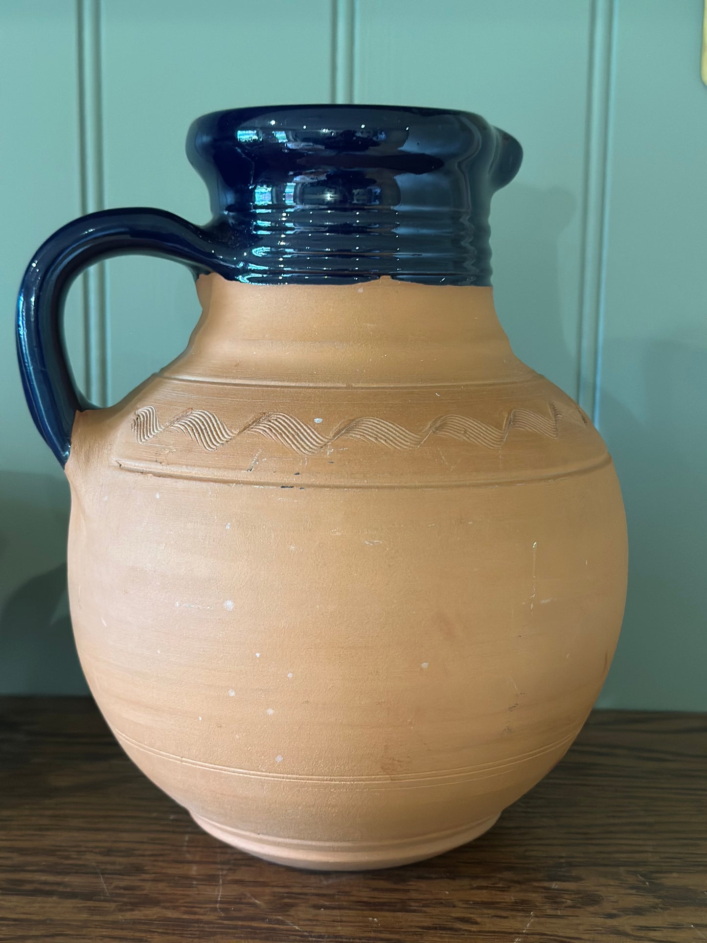 Vintage Greek water wine jug with material beaded lid