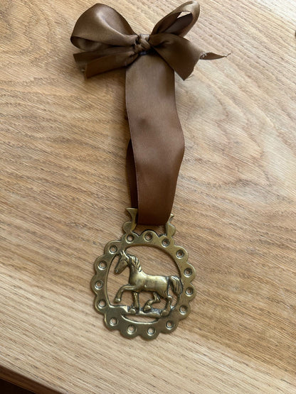 vintage brass token on bow ribbon