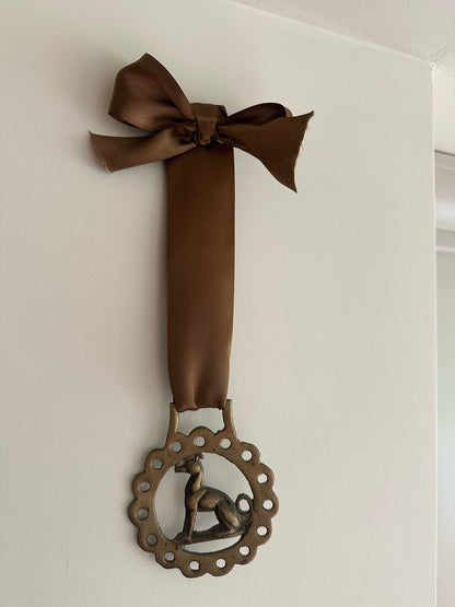 vintage brass token on bow ribbon