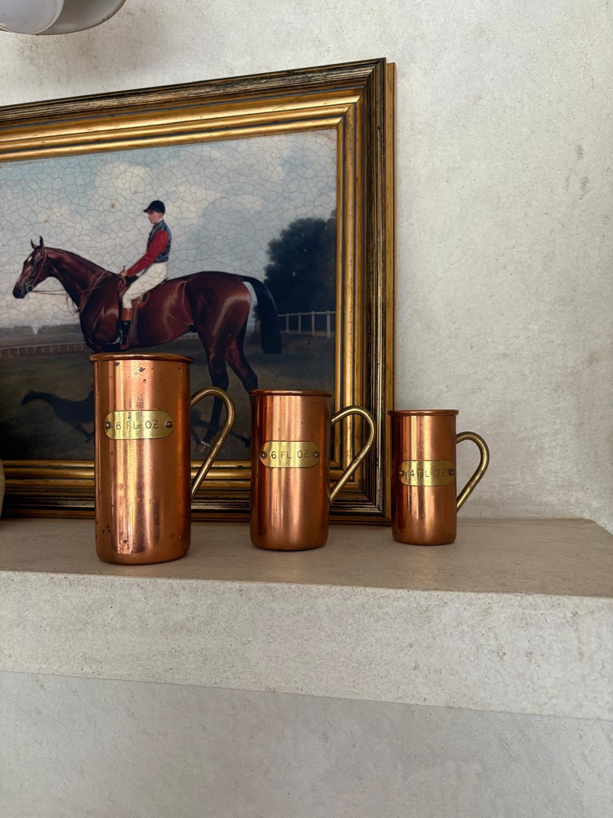 Vintage copper & brass measuring cups shelf styling