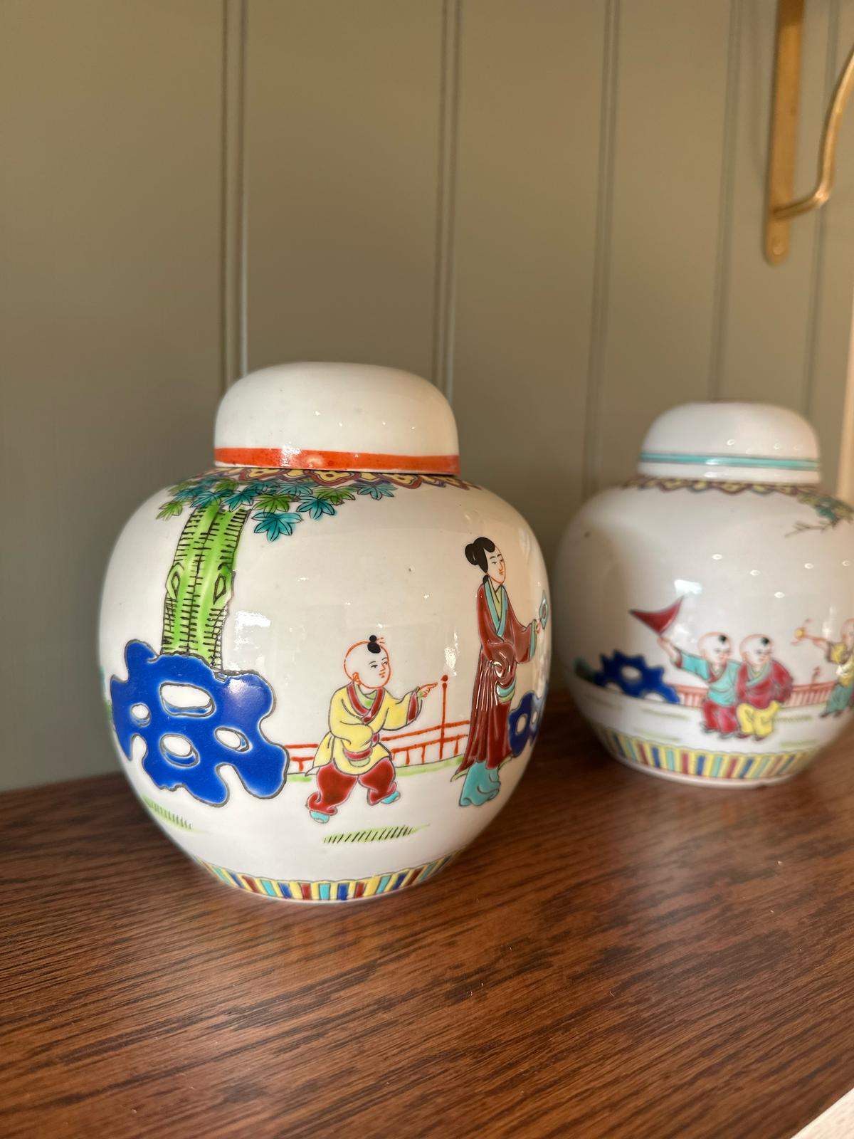 pair of vintage Chinese ginger jars with lids