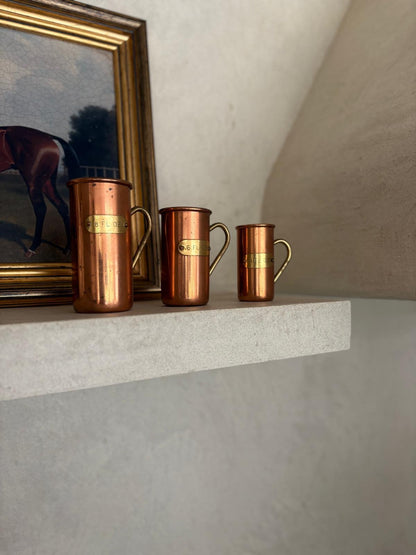 Vintage copper & brass measuring cups shelf styling