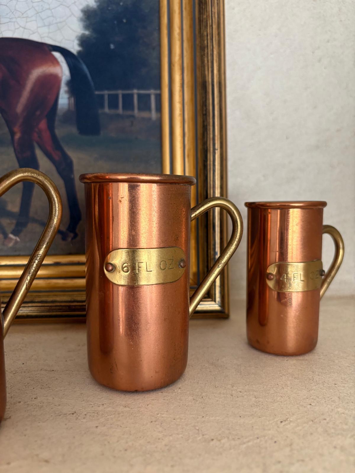 Vintage copper & brass measuring cups shelf styling