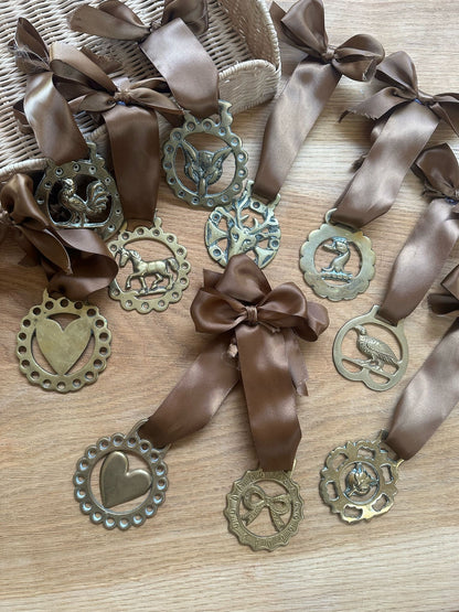 vintage brass token on bow ribbon