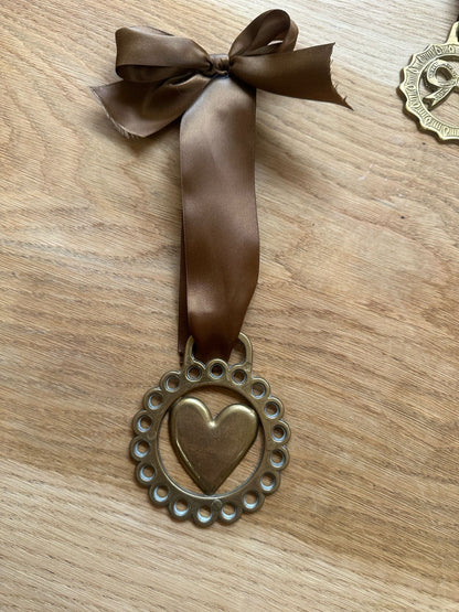 vintage brass token on bow ribbon