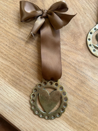 vintage brass token on bow ribbon
